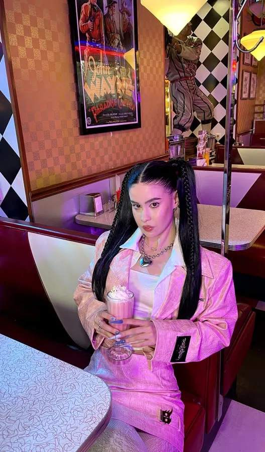 Artist wearing Pinkspink on a night street